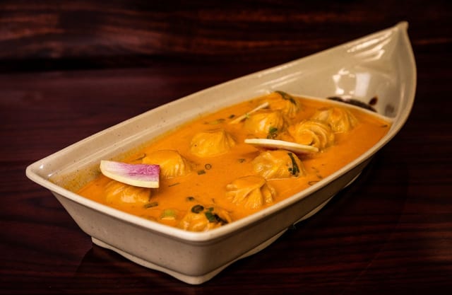 Titanic Chicken Jhol Momo-Chef Signature.